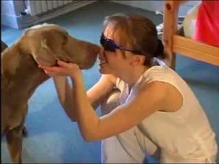 Naughty young girl plays with her cute doggy